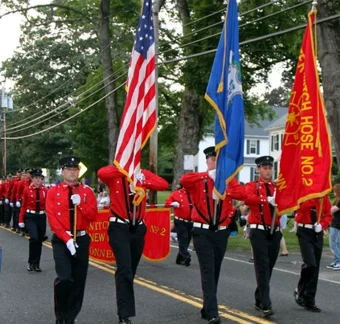 Marchers and fire trucks in the Bridgewater Fair parade